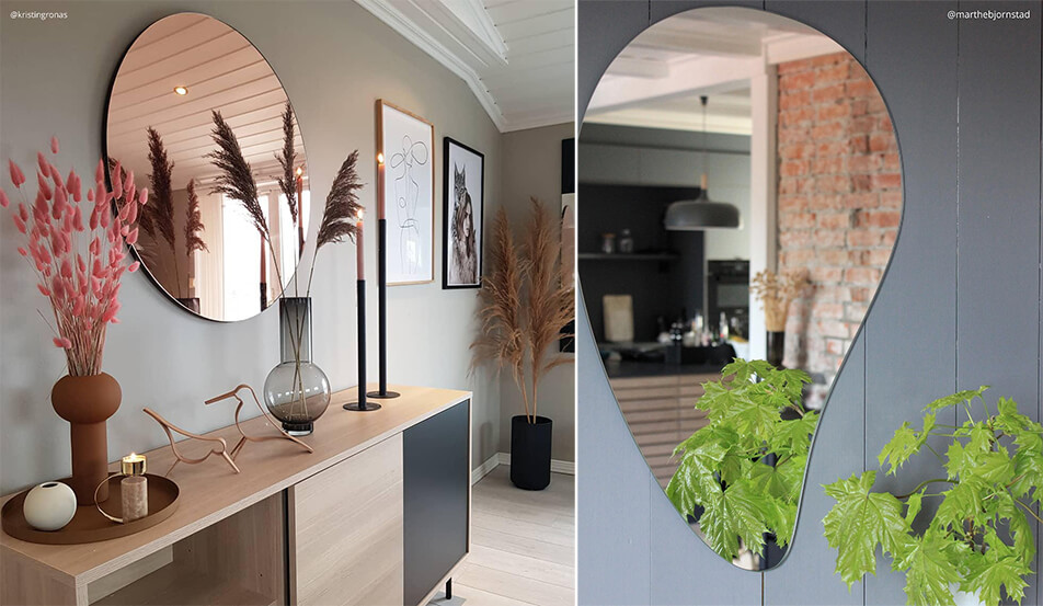 Runder Spiegel in Roségold an grauer Wand  - tropfenförmiger Spiegel an grauer Wand